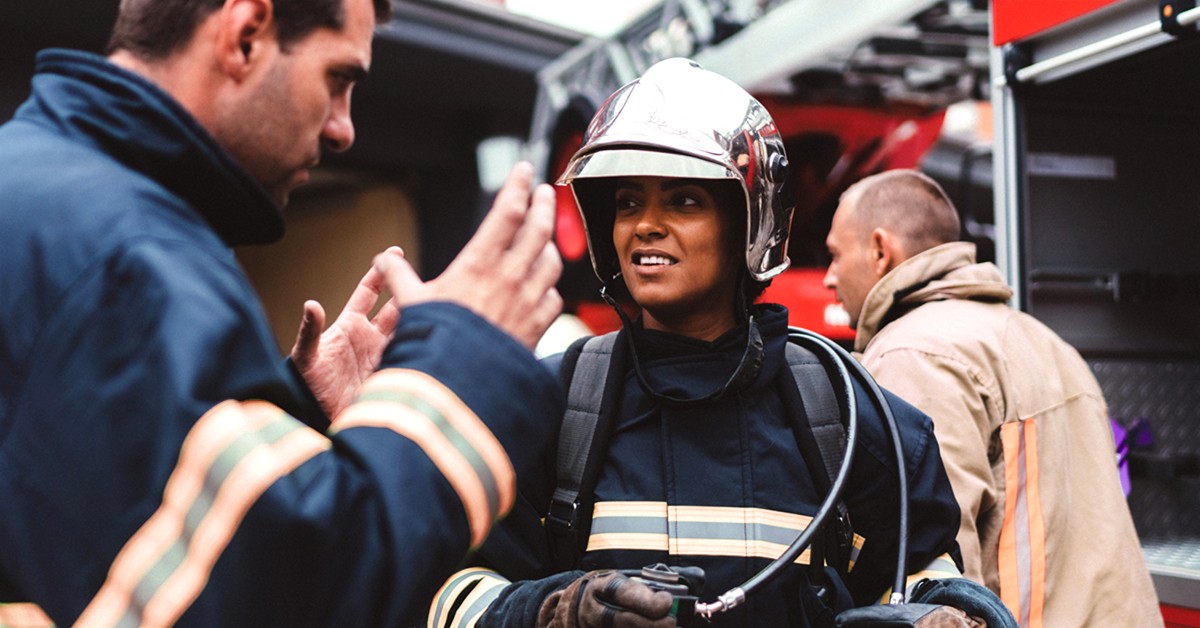 Firefighters communicating with each other